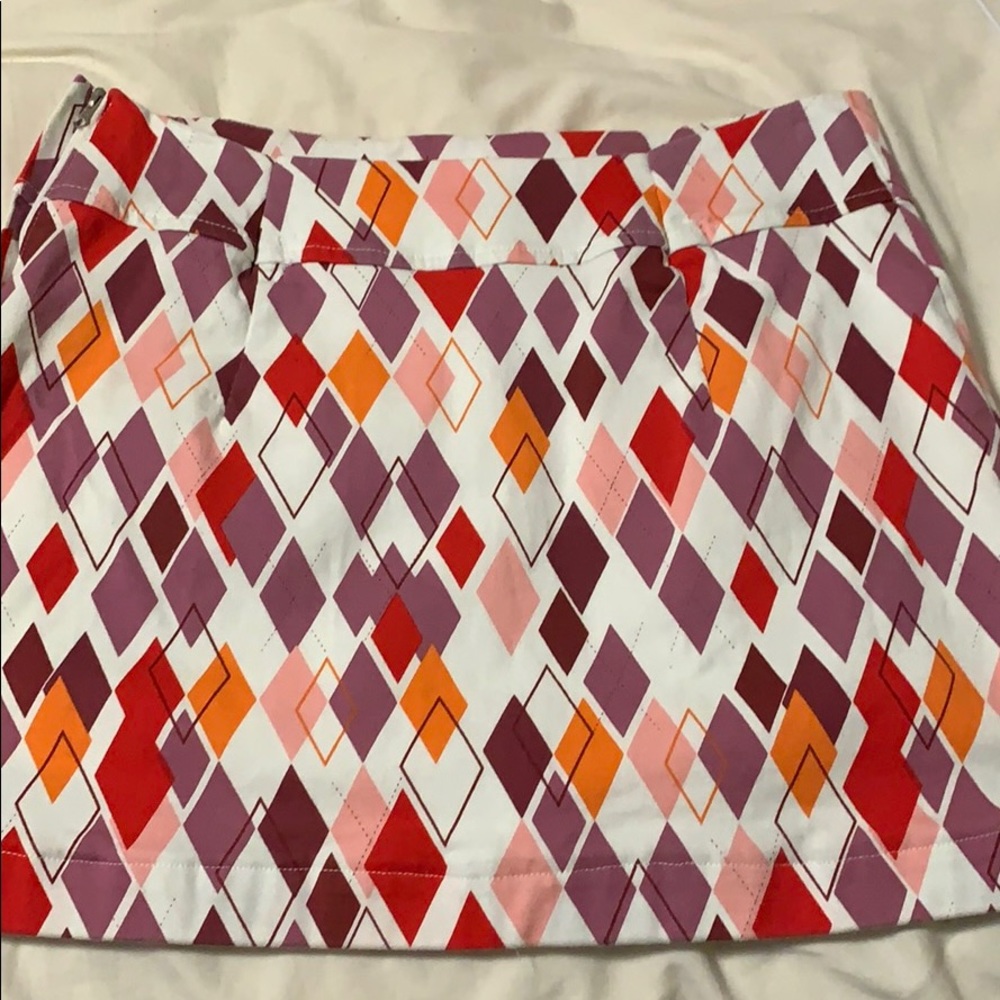 Shortened golf skirt. Size 4